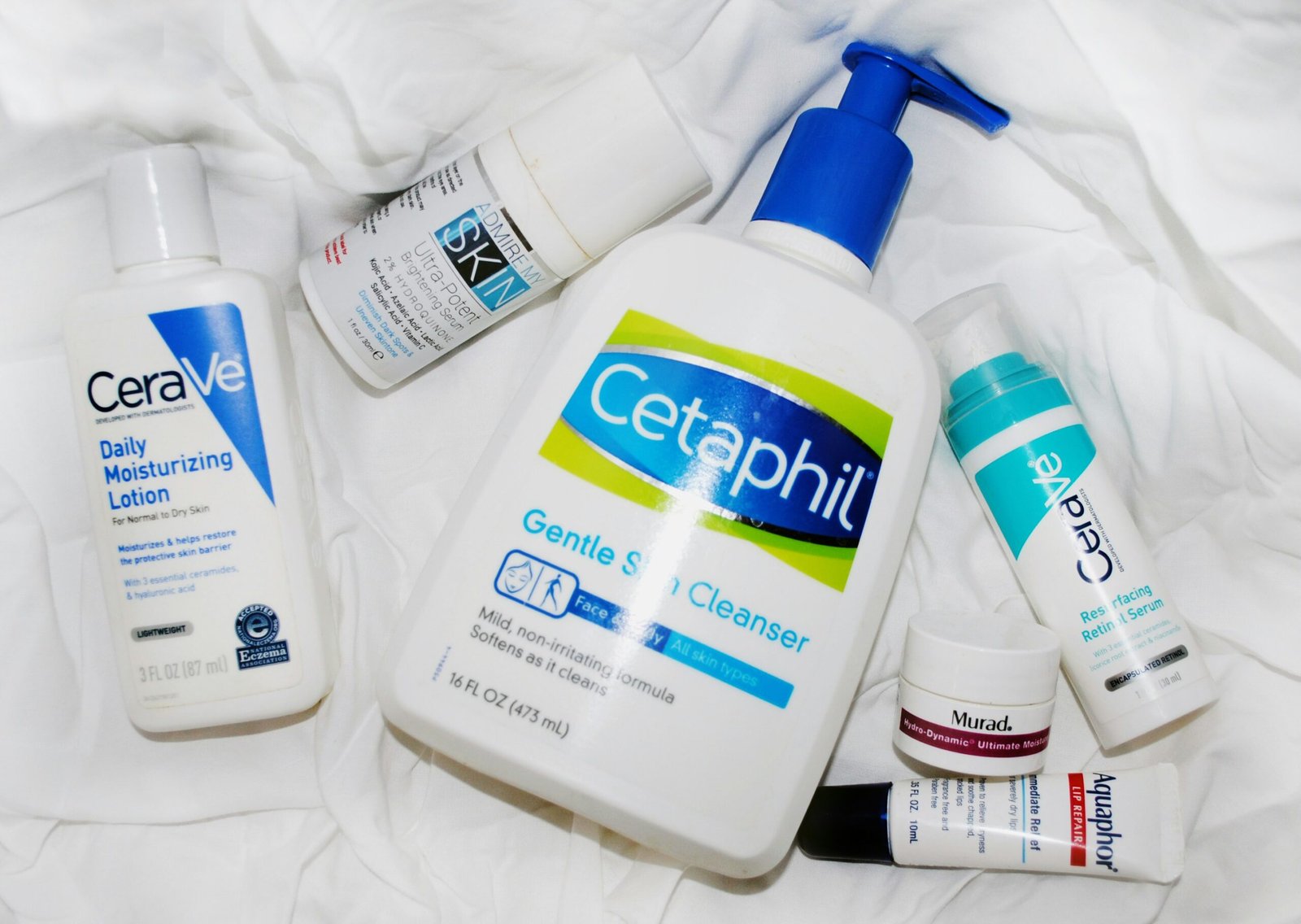CeraVe Moisturizing Cream jar and Cetaphil Moisturizing Cream tube placed side by side